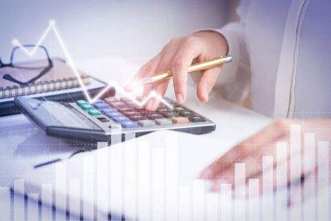 accountant-calculating-profit-with-financial-analysis-graphs-(1) (1)